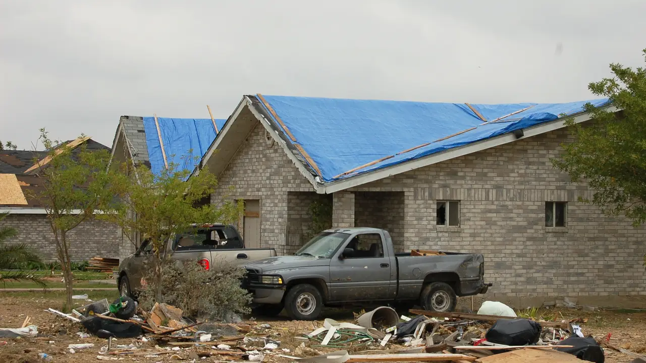 Tarp covering a damaged roof on a house